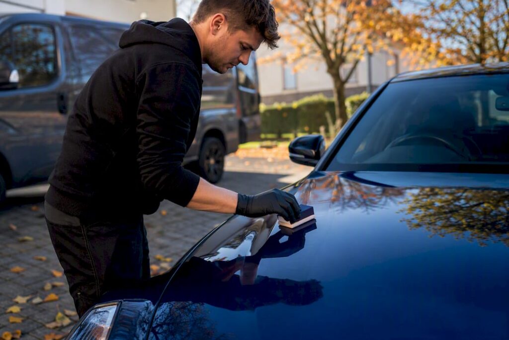 Close-up of ceramic coating application on car hood