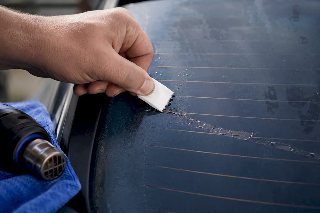 Careful tint removal near rear defroster lines
